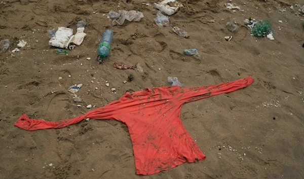 A shirt found on the beach after a boat capsized leaving deaths in Dakar, Senegal, Monday, July 24, 2023. (AP)