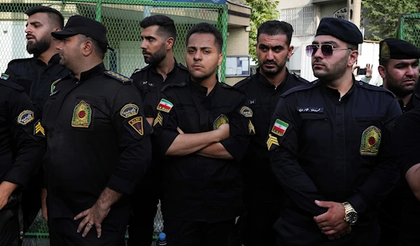 Iranian police officers stand guard during a protest against Sweden in front of the Swedish Embassy in Tehran, Iran, Friday, July 21, 2023. (AP)