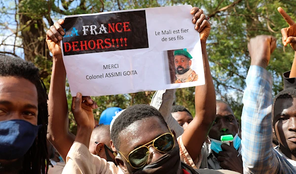 People join a government-sponsored rally in Mali's capital Bamako on Jan. 14, 2021, to protest new regional economic sanctions and growing pressure from former colonizer France. (AP)