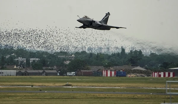 The Dassault Rafale jet performs a demonstration flight during the Paris Air Show in Le Bourget, north of Paris, France, June 19, 2023 (AP)