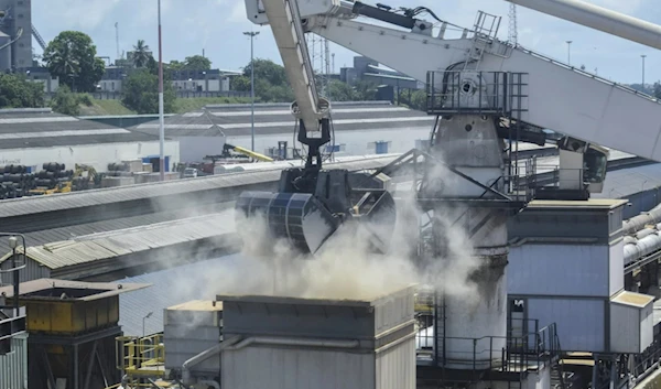 More than 50,000 tons of wheat for commercial use in Kenya and procured under the Black Sea Grain Initiative is offloaded from the Eaubonne bulk carrier ship after it docked in Mombasa, Kenya. (AP)