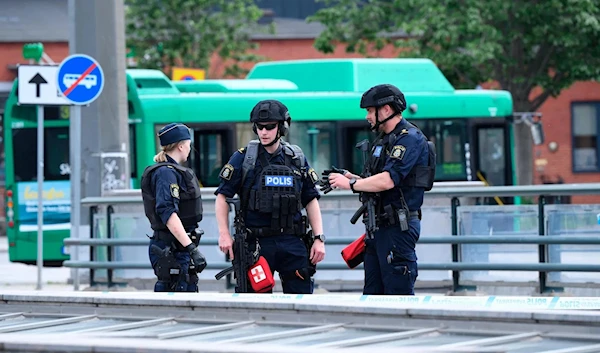 Police offices attend the scene after police shot and wounded a man at Malmo central station, Sweden, Monday June 10, 2019. Swedish police say officers have shot and wounded a man who was threatening people at a train station. (AP)