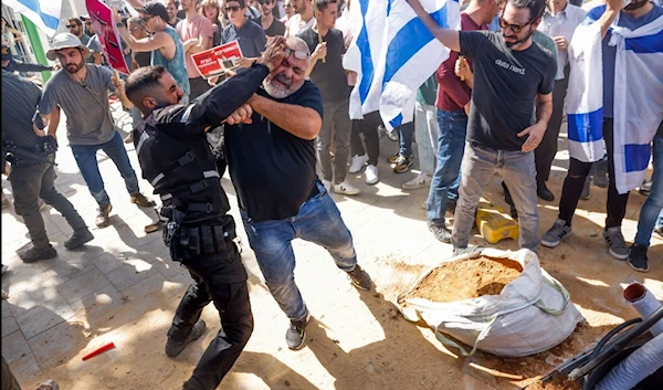 Protesting Israeli settlers vs. police: Punching, kicking and whipping