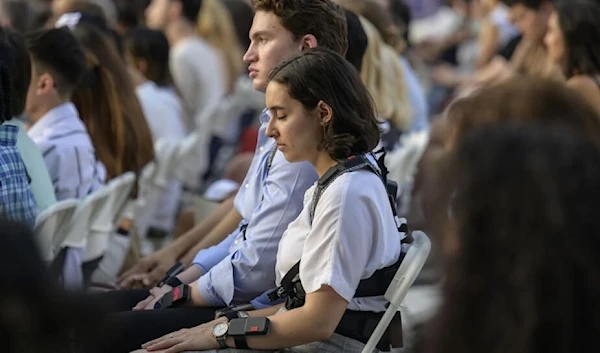 Concertgoers in New York wear haptic suits, which translate music into vibrations on the body, created for the deaf community (AFP)