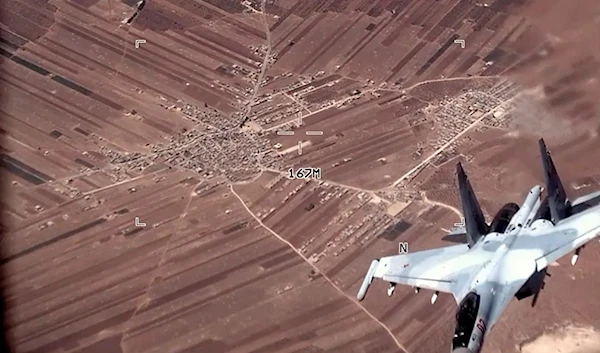 In this image from video released by the US Air Force, a Russian Su-35 flies near a U.S. Air Force MQ-9 Reaper drone on July 5, 2023, over Syria (US Air Force via AP)