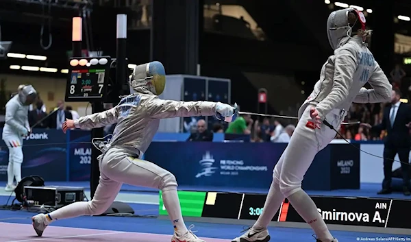 Ukrainian fencer squaring off against her Russian competitor (AFP)