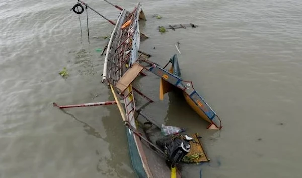 This photo taken by drone shows the remains of a passenger boat that capsized in Binangonan, Rizal province, Philippines on Friday. (AP)