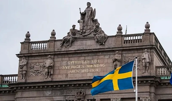 The Swedish flag flies in front of the Swedish Parliament on Sweden, Stockholm on April 16, 2020 (AFP) April 16, 2020 (AFP)