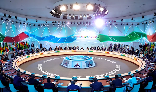 Russian President Vladimir Putin, centre, speaks during a plenary session at the Russia Africa Summit in St. Petersburg, Russia, Friday, July 28, 2023 (Donat Sorokin/TASS Host Photo Agency Pool Photo via AP)