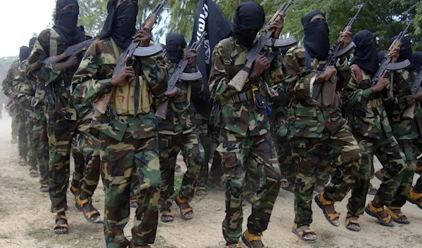 Al-Shabaab fighters conducted military exercises in northern Modadishu's Suqaholaha neighborhood, Somalia, on September 5, 2010. (AP)