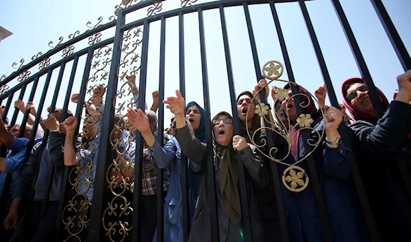 The MKO members protest the Albanian police's raid on a terrorist group's camp in Tirana on June 20, 2023. (AFP)