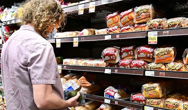 A woman shopping at a grocery shop. (AFP)