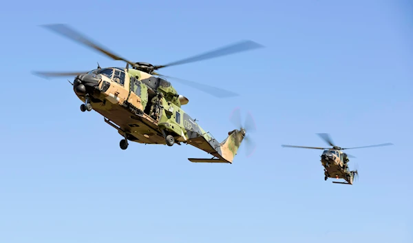 In this photo provided by the Australian Defense Force Australian Army MRH-90 Taipan helicopters prepare to land at Townsville, Australia, May 10, 2023, during Exercise Brolga Run 23, (AP)