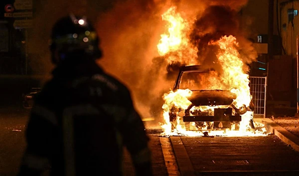 Protesters lit fires at police stations and other public buildings on Thursday. (AFP)