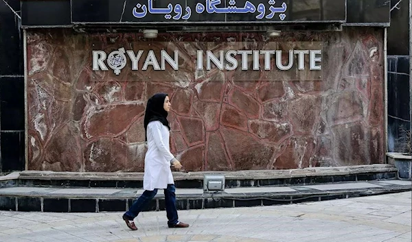 An Iranian female doctor passing near the entrance of Royan Institute in Tehran on February 3, 2019. (Mehr News Agency)