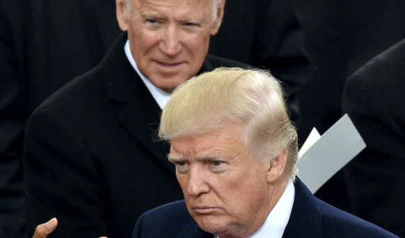 Current US President Joe Biden and former President Donald Trump at Trump's inauguration in 2017 (AFP)