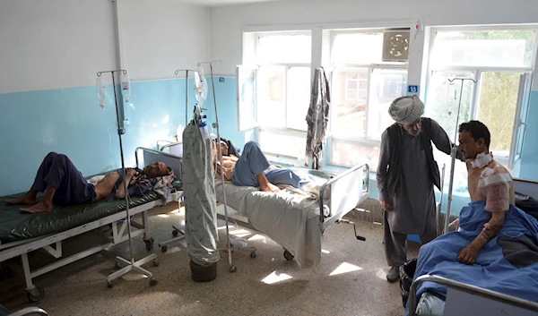 In this Sunday, Aug. 12, 2018, photo, injured men receive treatment at a hospital in Ghazni province, west of Kabul, Afghanistan. (AP)