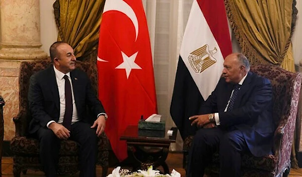 Egyptian Foreign Minister Sameh Shoukry, right, meets with his Turkish counterpart Mevlut Cavusoglu at Tahrir Palace in Cairo, Egypt, March 18, 2023. (AP)