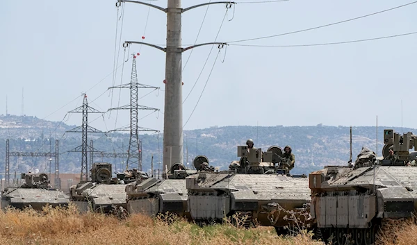 Israeli occupation soldiers drive an APC out of the occupied West Bank city of Jenin, Palestine, Tuesday, July 4, 2023 (AP Photo)