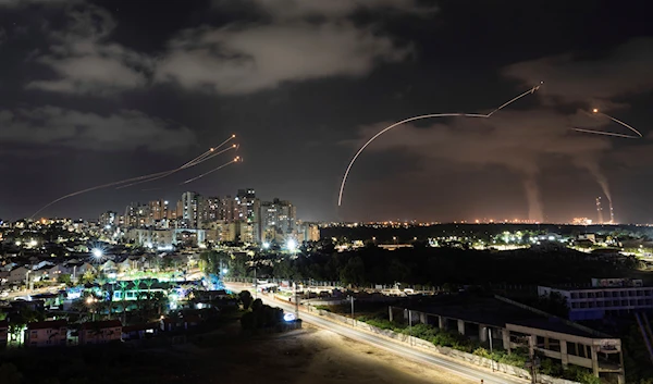 The Israeli Iron Dome anti-air system fires interceptors at rockets launched from the Gaza Strip, in Askalan, occupied Palestine (AP)