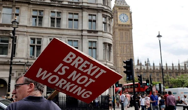 An anti-Brexit protestor near the UK Houses of Parliament in July 2022 (AFP)