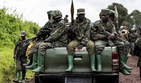 M23 rebels prepared to leave after a ceremony to mark the withdrawal from their positions in Kibumba, in eastern Dr Congo, in December 23, 2022. (AP)