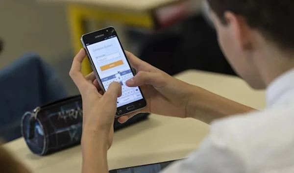 Taken on Sept. 26, 2017, high school students use smartphones and tablet computers at the vocational school in Bischwiller, eastern France.