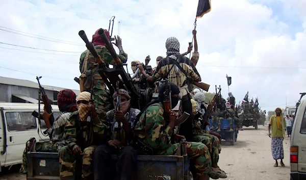 In this photo taken Thursday, Oct. 21, 2010, al-Shabaab fighters display weopons as they conduct military exercises in northern Mogadishu, Somalia. (AP)