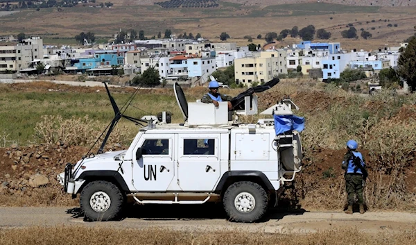 UN peacekeeping patrol on the Lebanese side of the border with "Israel" with order village Ghajar in the background, on Thursday, July 6, 2023. (AP)