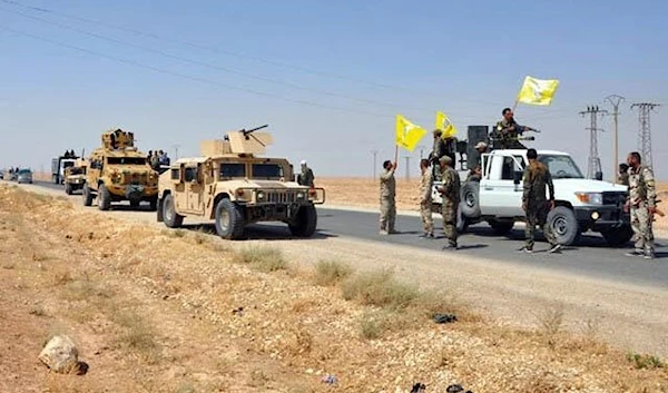 US-backed Syrian Democratic Forces, ride in armoured vehicles near the town of Shadadi, about 60 kilometres south of the northeastern Syrian city of Al-Hasakah, on Friday 25 August 2017 (AFP photo)