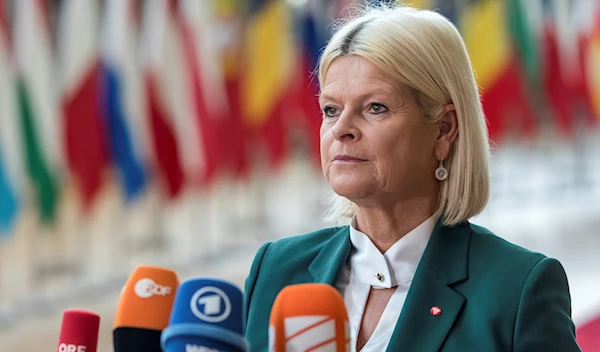 Austria's Defense Minister Klaudia Tanner talks to journalists as she arrives for a meeting of EU defense ministers at the EU Council building in Brussels, Tuesday, Nov. 15, 2022. (AP)