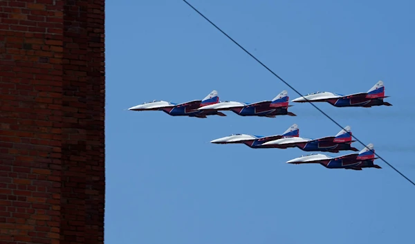 MiG-29 fighter jets of Strizhi (Swifts) aerobatic demonstrator team perform during an aerobatic air show at the International Maritime Defense show in Kronstadt Navy base, outside St. Petersburg, Russia, June 21, 2023 (AP)