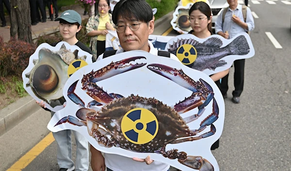 Affiliates of the opposition Justice Party in South Korea rally against Japan's plan to discharge treated water from the destroyed Fukushima nuclear power plant into the ocean, Downtown, Seoul, South Korea, July 8 2023. (AFP)