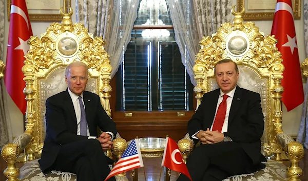 Turkish President Recep Tayyip Erdogan and US President Joe Biden pose for photographers before their meeting at Yildiz Mabeyn Palace in Istanbul, in January 23, 2016. (AP)