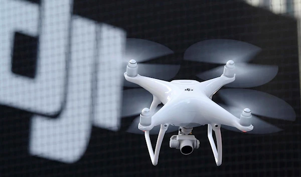 A Phantom 4, developed by major Chinese consumer-drone maker DJI, flies during its demonstration flight in Tokyo, Thursday, March 3, 2016 (AP)