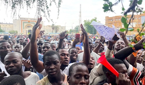 Supporters of the military council demonstrate in Niamey, Niger, Thursday July 27 2023 (AP Photo/Sam Mednick)