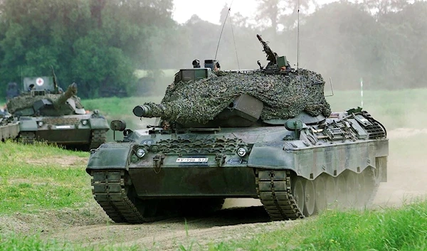 A Leopard 1 tank drives in Storkau, Germany, on May 19, 2000. (AP)