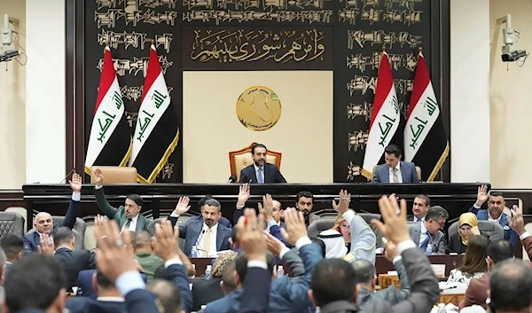 This photo from Iraqi parliament shows the Iraqi lawmakers attend a parliamentary session to vote on the federal budget at the parliament headquarters in Baghdad, Iraq, Sunday, June 11, 2023. (AP)