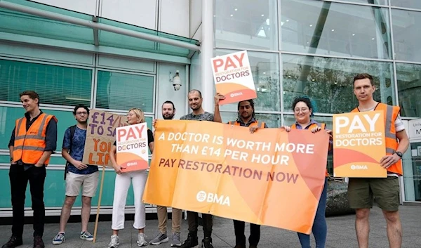 Junior doctor members of the British Medical Association (BMA) stand on the picket line outside UCLH at the start a strike amid the bitter dispute with the Gov. over pay, in London, on August 11, 2023. (AP)