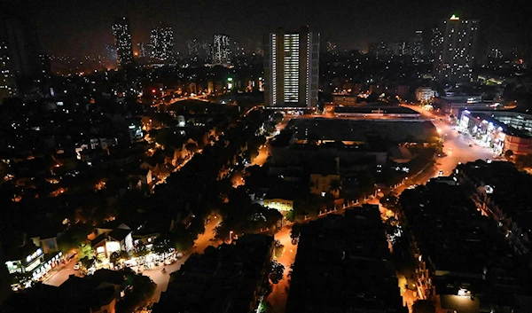 A view of Hanoi on May 30 as some street lights were turned off to save electricity (AFP)