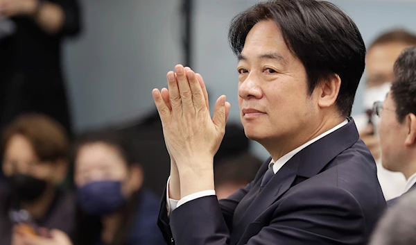 Taiwan's Vice President Lai Ching-te, also known as William Lai, cheers during a press conference in Taipei, Taiwan, April 12, 2023 (AP)