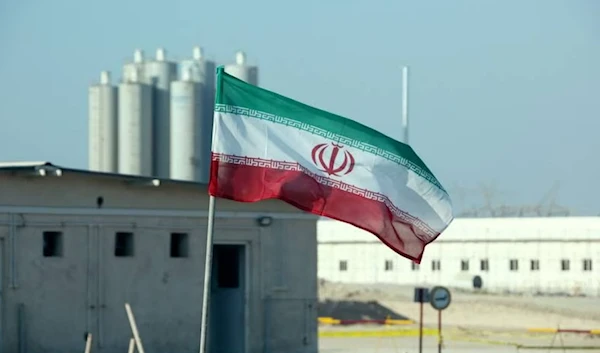 An Iranian flag flies in Iran's Bushehr nuclear power plant in November, 2019, during an official ceremony to kick-start works on a second reactor at the facility. (AP)