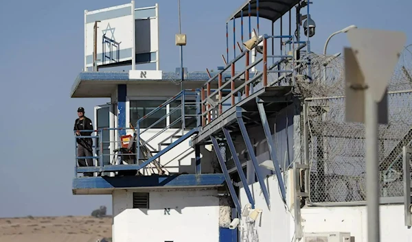 A member of the Israeli occupation forces stands guard at the Gilboa prison in northern Palestine.(AFP)