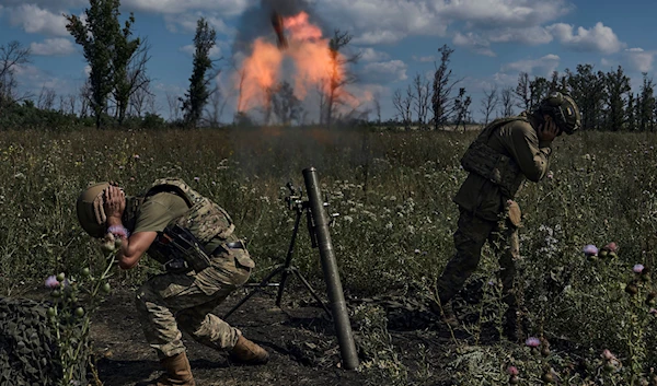 Ukrainian soldiers fire a mortar towards Russian positions at the front line, near Bakhmut, Donetsk People's Republic, Aug. 12 2023 (AP)