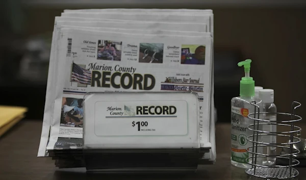 The last printed issue of The Marion County Record sits in a display in its office, August 13, 2023. (AP)