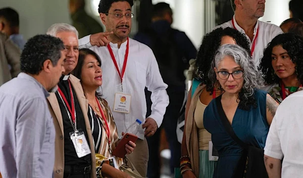 Negotiator for the Colombian government, Ivan Cepeda, center, points during the start of the fourth cycle of peace talks with the Colombian guerrilla National Liberation Army (ELN), at the Aquiles Nazoa Cultural Center in Caracas, Venezuela, Aug. 14, 2023.