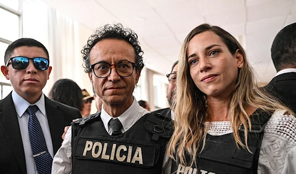 Christian Zurita, center, and his running mate Andrea Gonzalez following a press conference in Quito on Aug. 13. ( AFP via Getty Images)