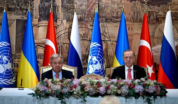 United Nations Secretary-General Antonio Guterres (L) and President Recep Tayyip Erdoğan sit at the start of the signature ceremony in Istanbul, Turkey, July 22, 2022. (AFP)