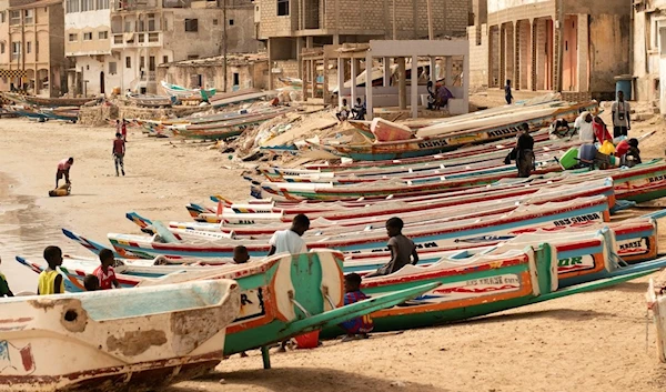 Children play on fishing boats known as “pirogues” in Dakar, Senegal, Saturday June 24, 2023. (AP)