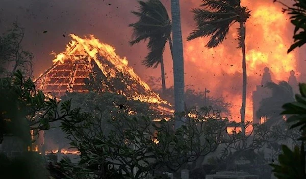 The hall of the historic Waiola Church and the nearby Lahaina Hongwanji Mission are engulfed in flames in Lahaina, Hawaii, on Tuesday August 8. (AP)